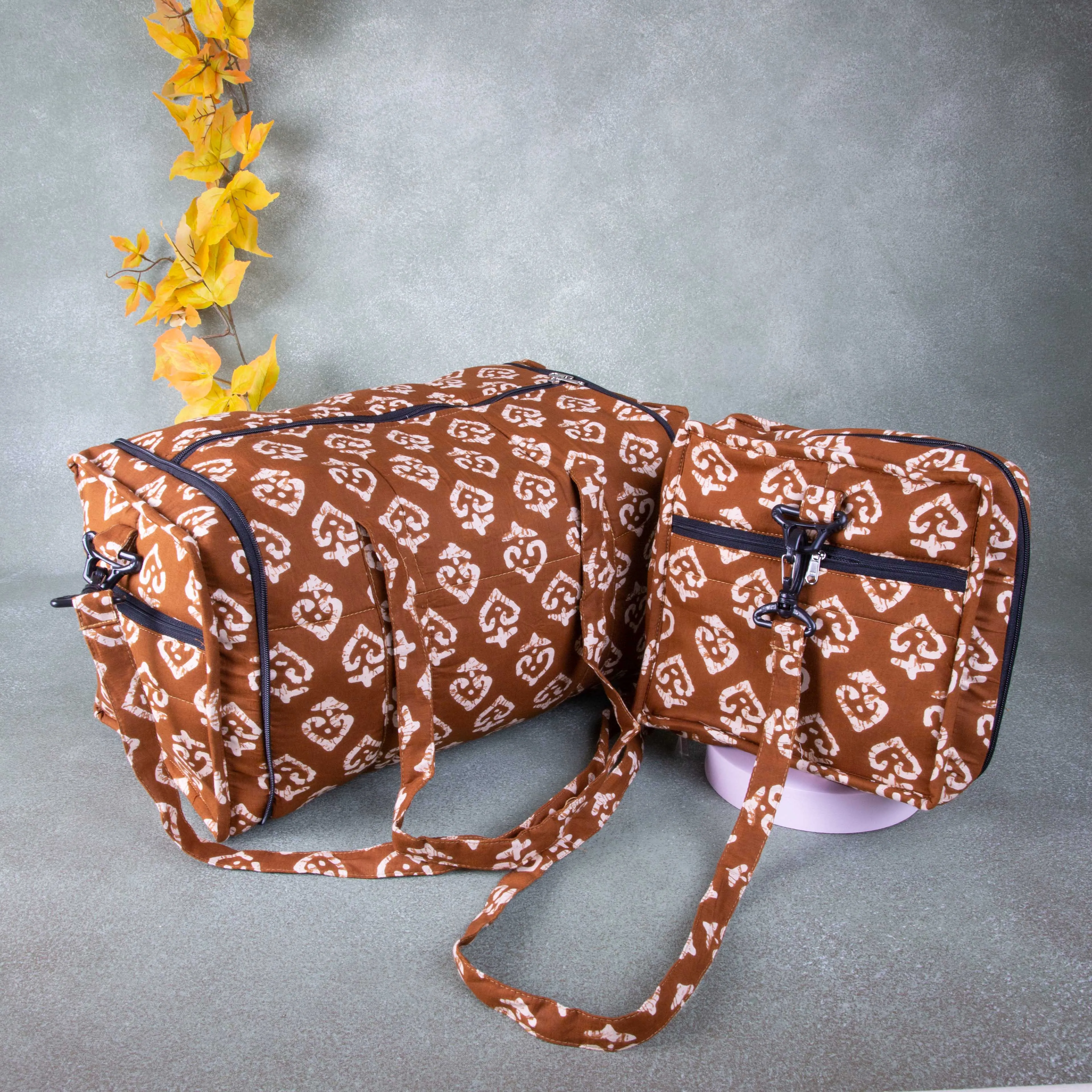 Expandable Travel Bag Brown with white flower Design.